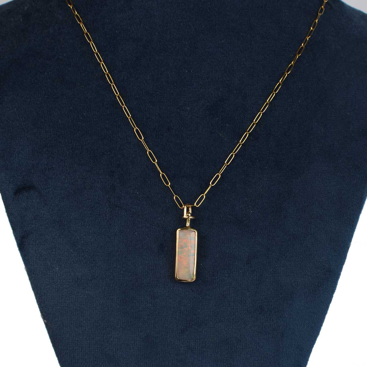 Dual Horizon one-of-a-kind necklace featuring double-sided Coober Pedy opal with red and pink flashes in 14K gold bezel with handcrafted swivel - ONG002