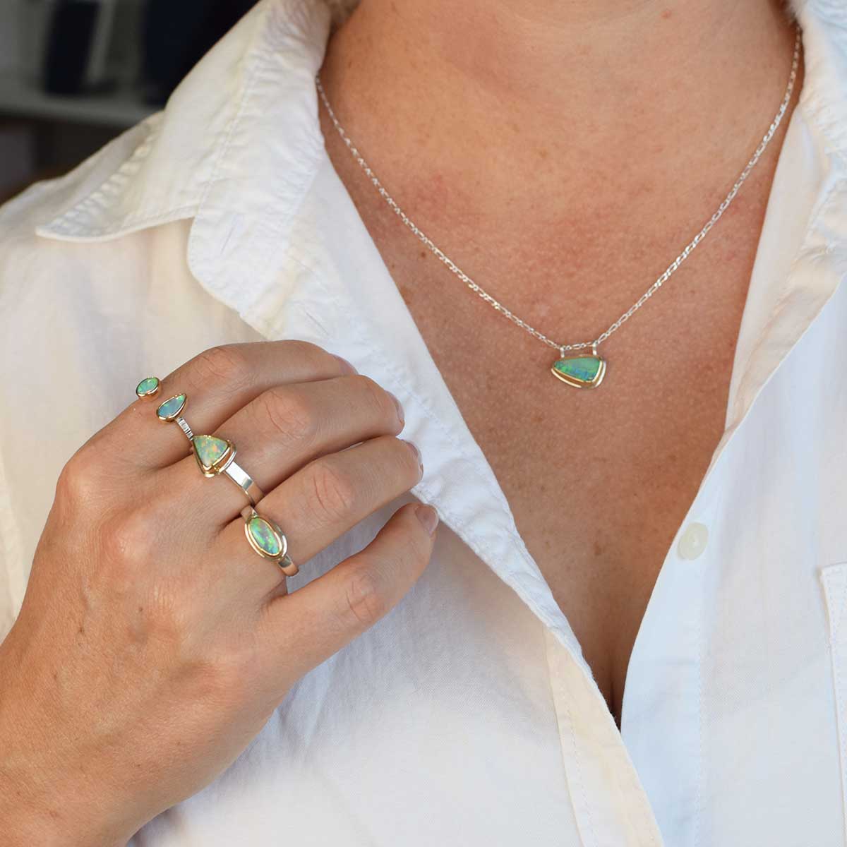 Shallow Reef Ring, Coober Pedy crystal opal set east-west in 14K gold bezel with sterling silver band, front view