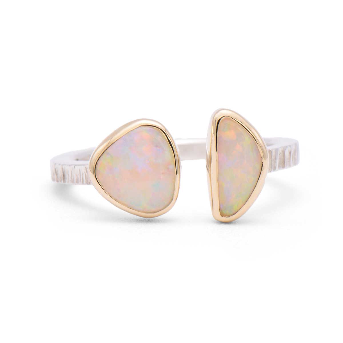Handcrafted split band ring featuring two natural Coober Pedy opals set in 14K gold with textured sterling silver band