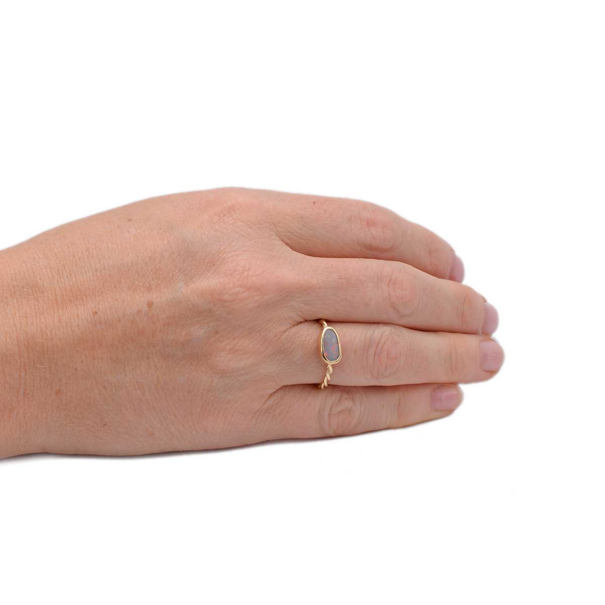 Close-up of freeform Lightning Ridge opal in Twilight Glow ring (ORG040) revealing detailed pink and purple splotches with hints of green