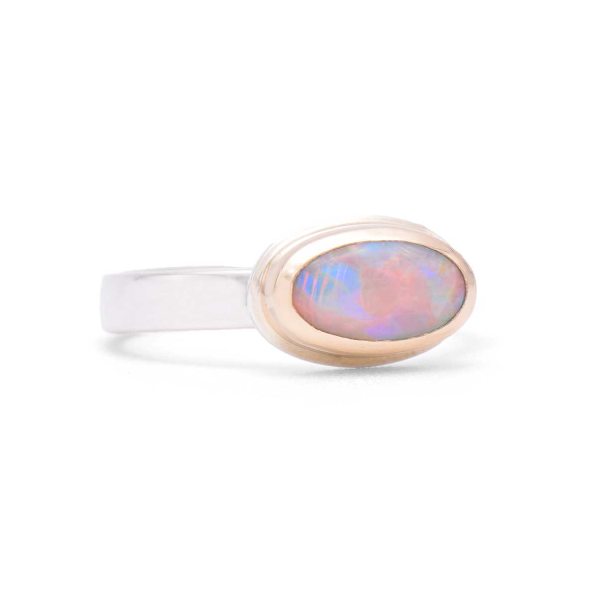 Aurora Oval handcrafted ring featuring east-west oval Coober Pedy opal with aurora-like pink, red and purple flashes in 14K gold bezel - ORMM105