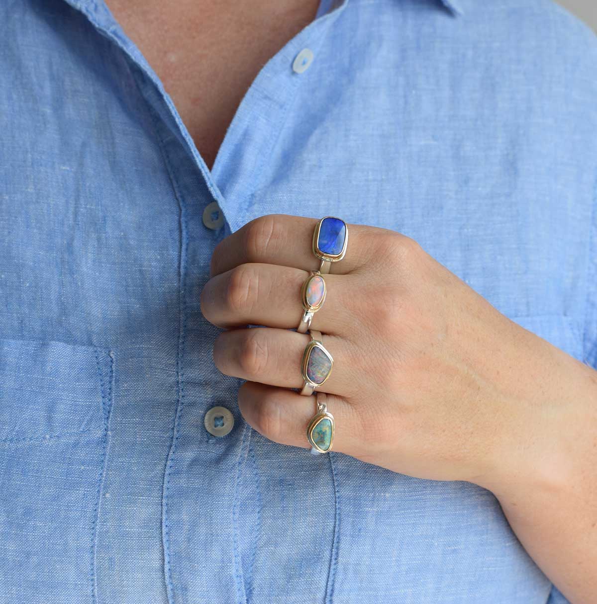 Aurora Oval handcrafted ring featuring east-west oval Coober Pedy opal with aurora-like pink, red and purple flashes in 14K gold bezel - ORMM105